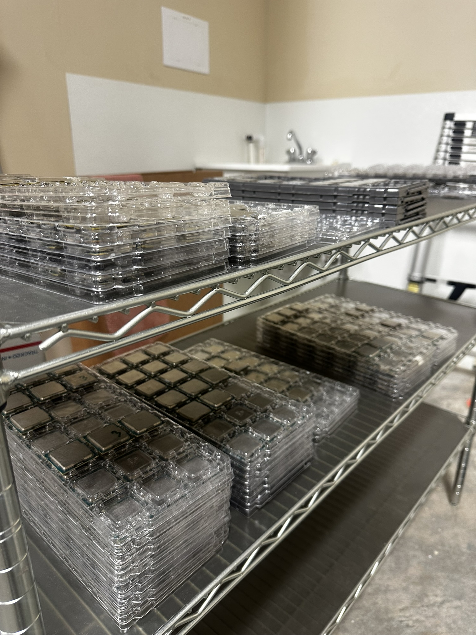 Pallets of e-waste in warehouse